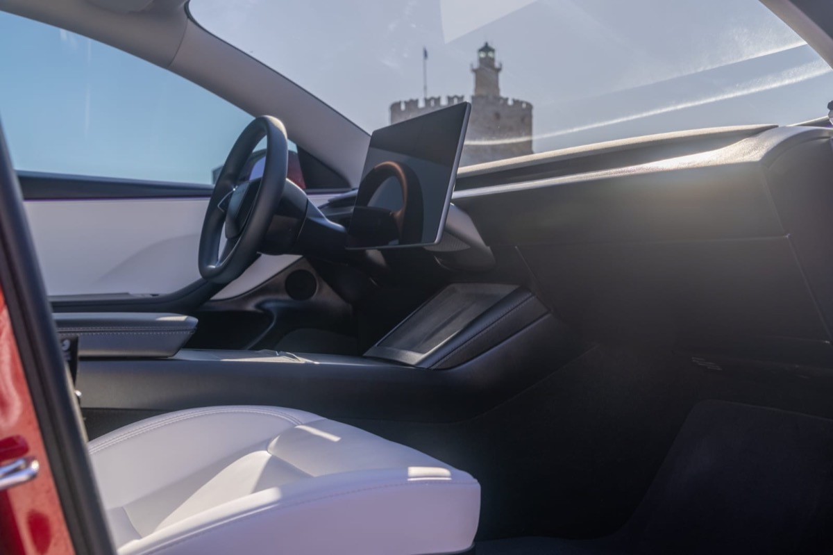 Tesla interior with Rhodes view